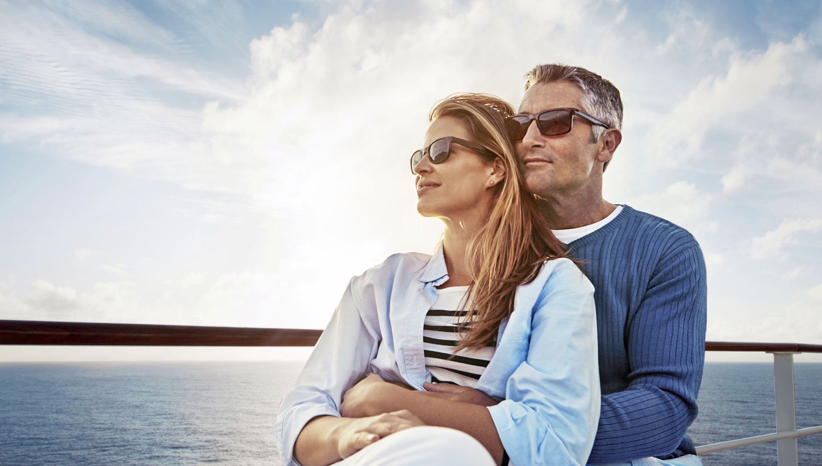 Couple enjoying ocean views on a cruise ship deck | MSC Cruises Couple enjoying ocean views on a cruise ship deck | MSC Cruises