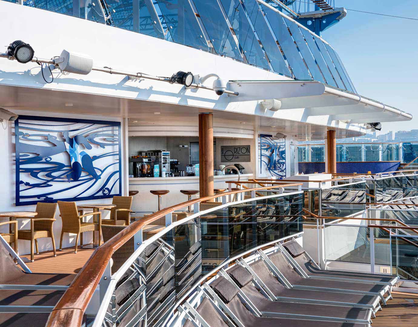 The Horizon Bar on an MSC Cruises ship with outdoor seating and sun loungers overlooking the sea | MSC Cruises The Horizon Bar on an MSC Cruises ship with outdoor seating and sun loungers overlooking the sea | MSC Cruises