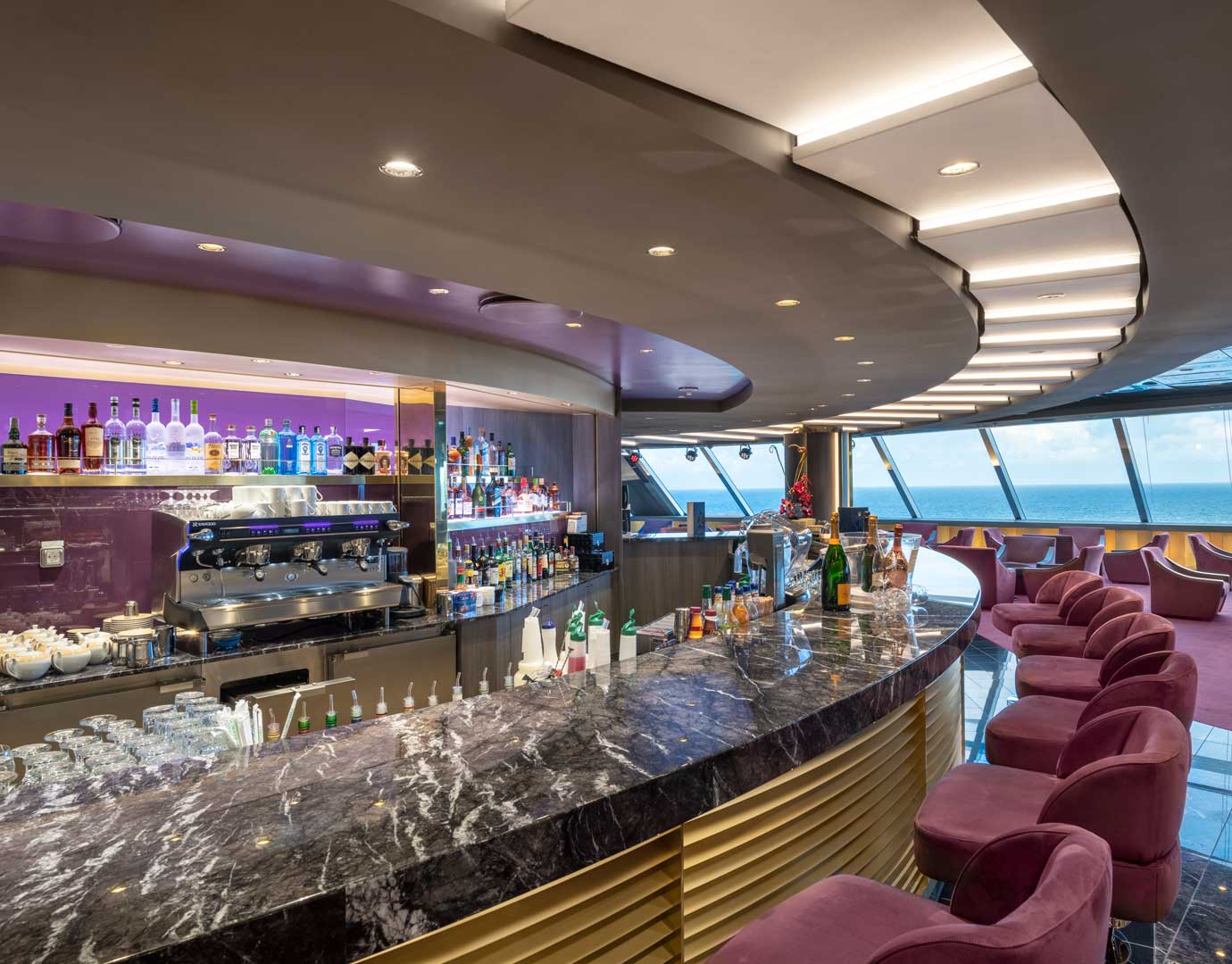 Elegant onboard bar with ocean views and plush seating | MSC Cruises Elegant onboard bar with ocean views and plush seating | MSC Cruises