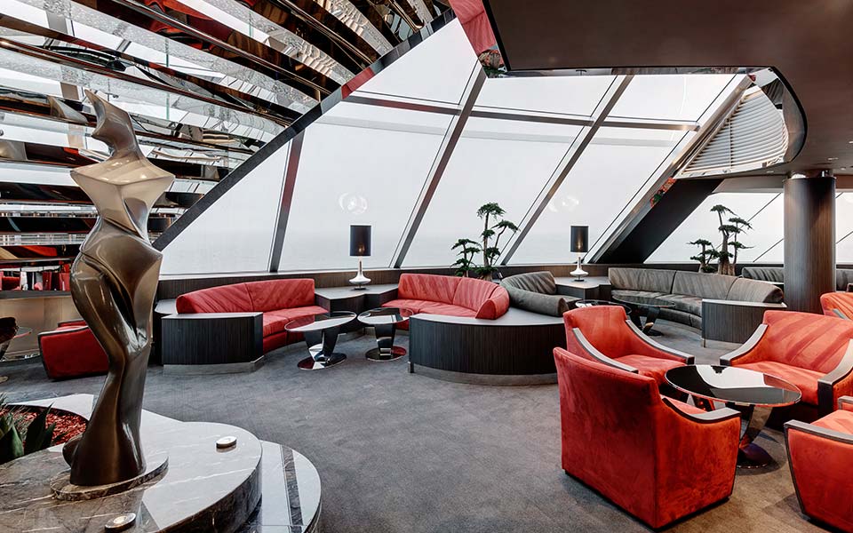 Luxurious lounge with modern decor and panoramic ocean views onboard | MSC Cruises Luxurious lounge with modern decor and panoramic ocean views onboard | MSC Cruises