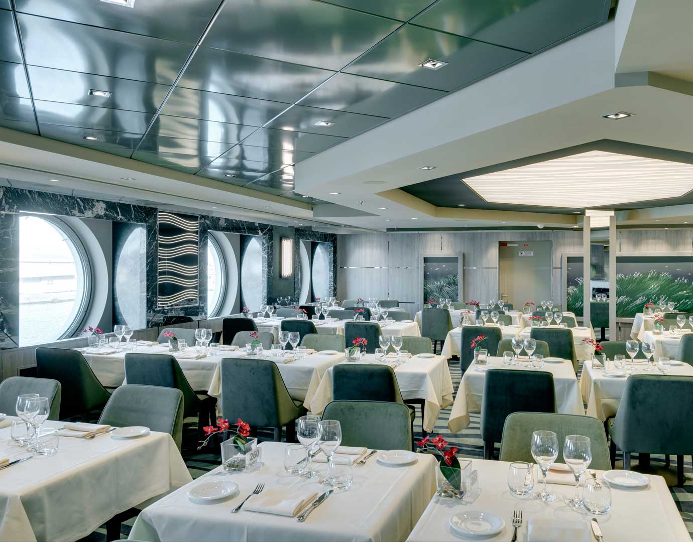 Elegant dining room with ocean views and modern decor onboard MSC Cruises | MSC Cruises Elegant dining room with ocean views and modern decor onboard MSC Cruises | MSC Cruises