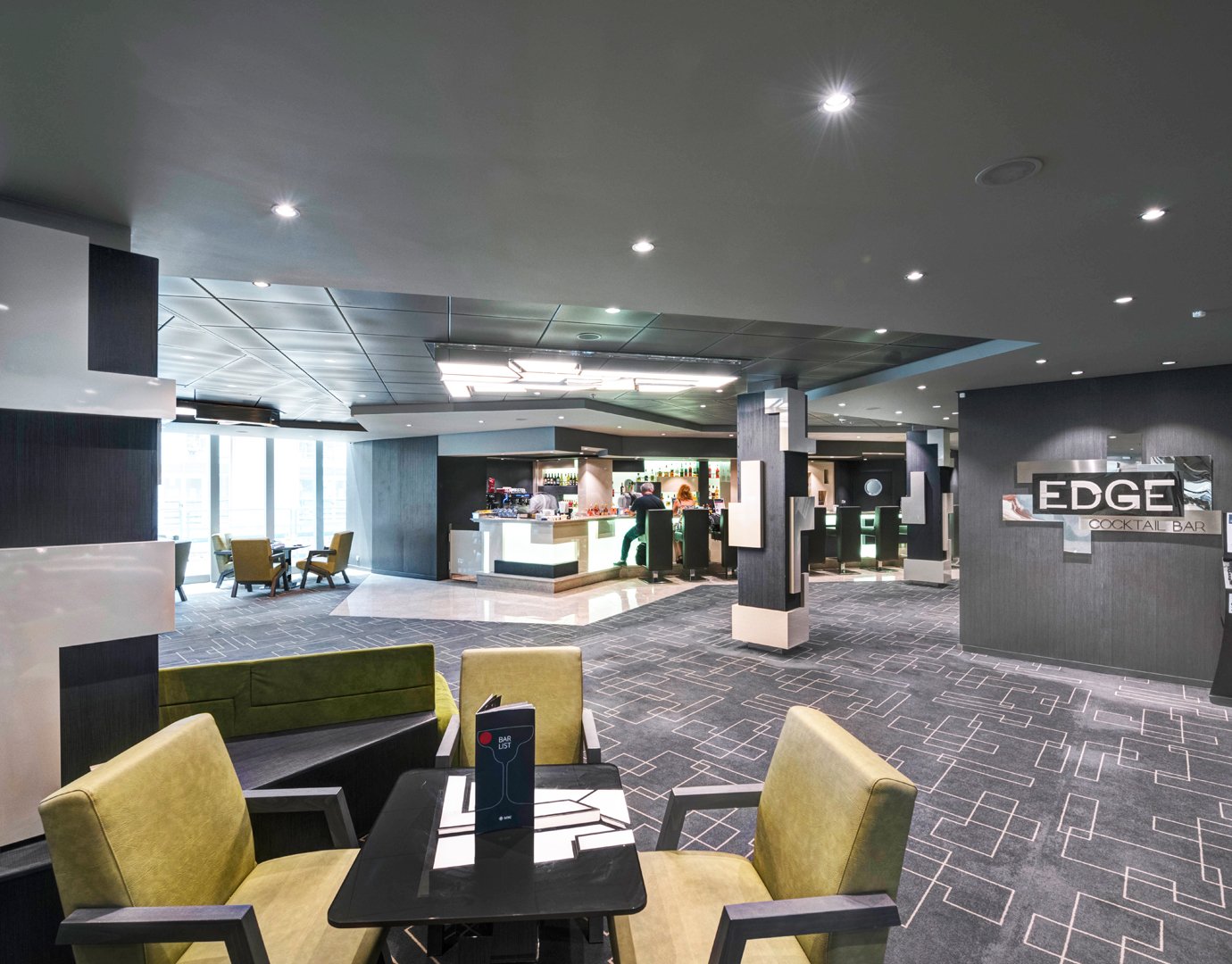 Modern cocktail bar with sleek decor and seating on an MSC cruise ship | MSC Cruises Modern cocktail bar with sleek decor and seating on an MSC cruise ship | MSC Cruises